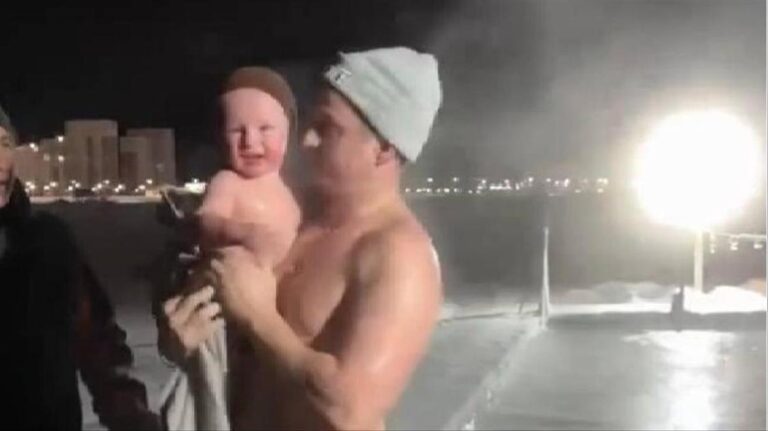 Russian Dad’s Icy Plunge with Toddler Sparks Heated Online Debate