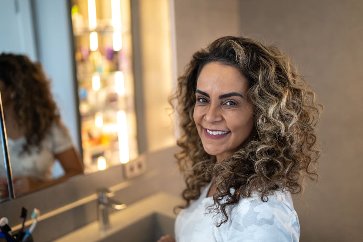 How to Get Picture-Perfect Holiday Hair 9 Jumbo curly rollers feature older woman