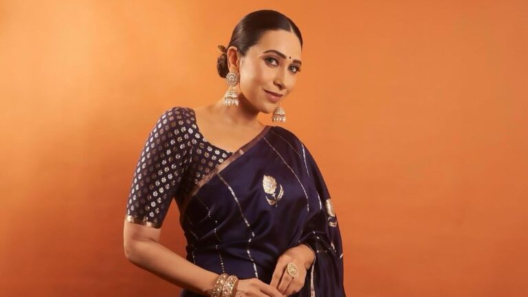 Karisma Kapoor’s indigo Manish Malhotra Benarasi sari is handwoven with intricate floral motifs