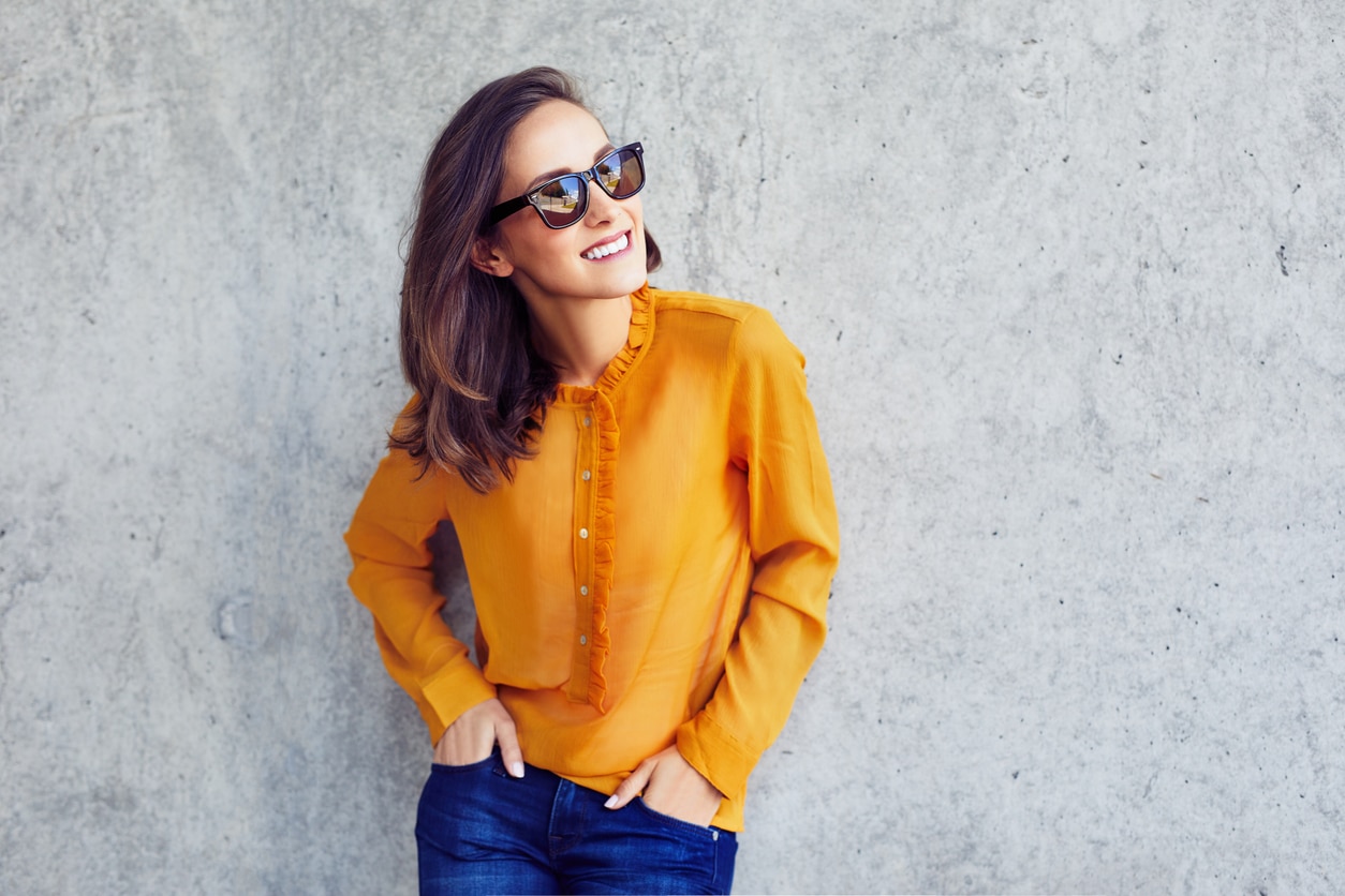 Woman in a bright orange shirt