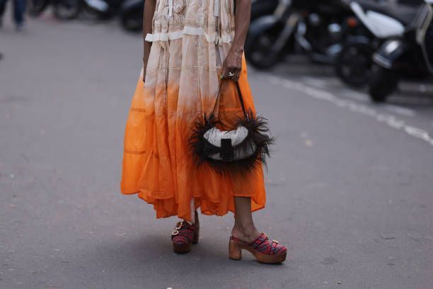 Image may contain Child Person Clothing Footwear High Heel Shoe Festival Halloween Motorcycle and Transportation