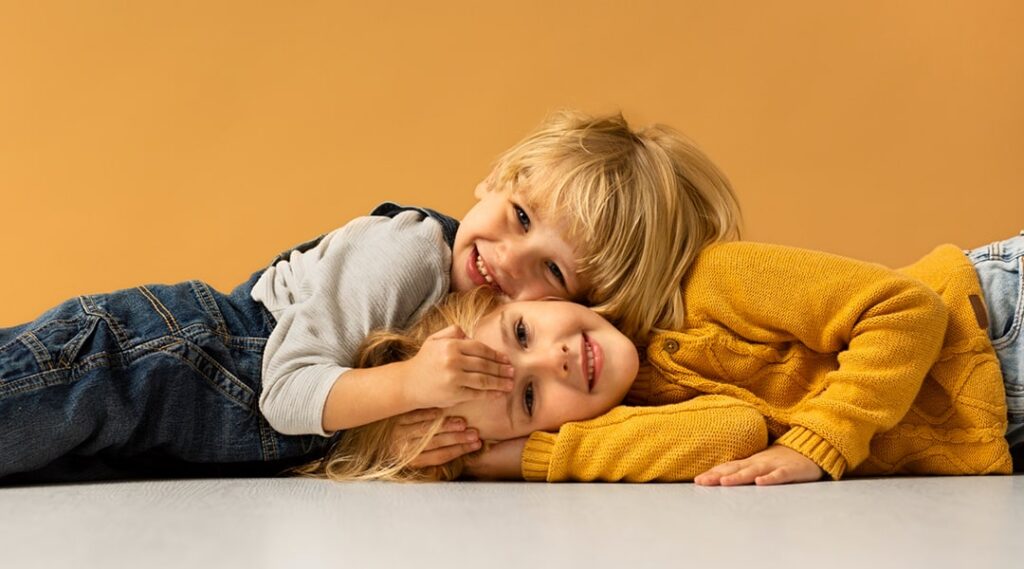 medium shot smiley kids posing indoors
