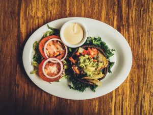 Swapping meat patties for options like portabello caps is one easy way to be more vegetarian. 