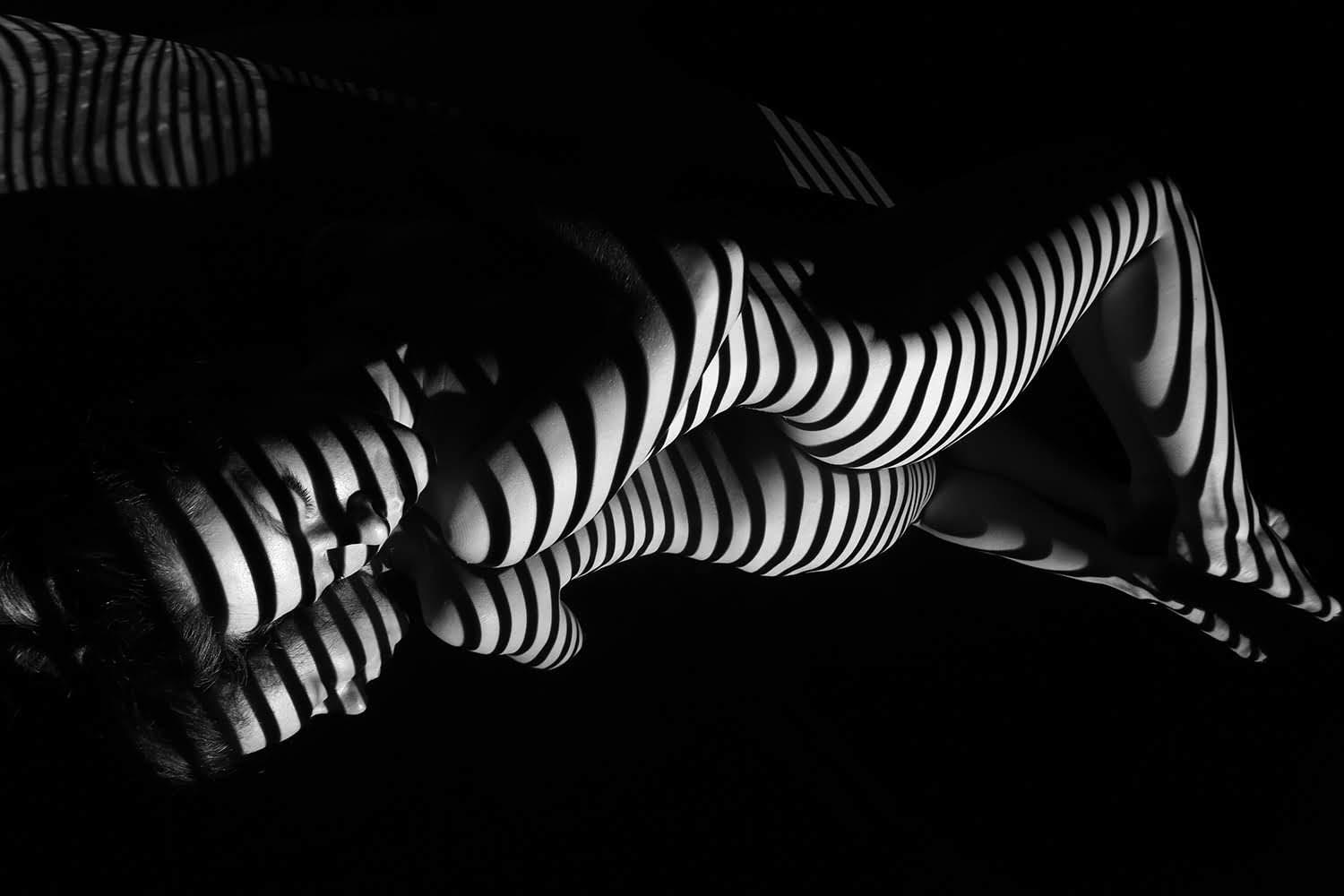 the nude woman with black and white zebra stripes