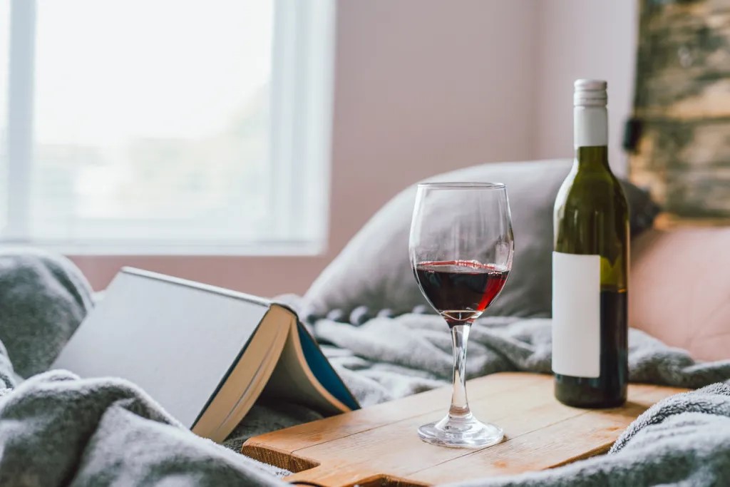 7 Habits that Make You Age Faster 2 wine in bed