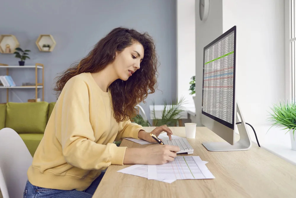 A busy woman working from home for the blog post unconventional ways to increase productivity